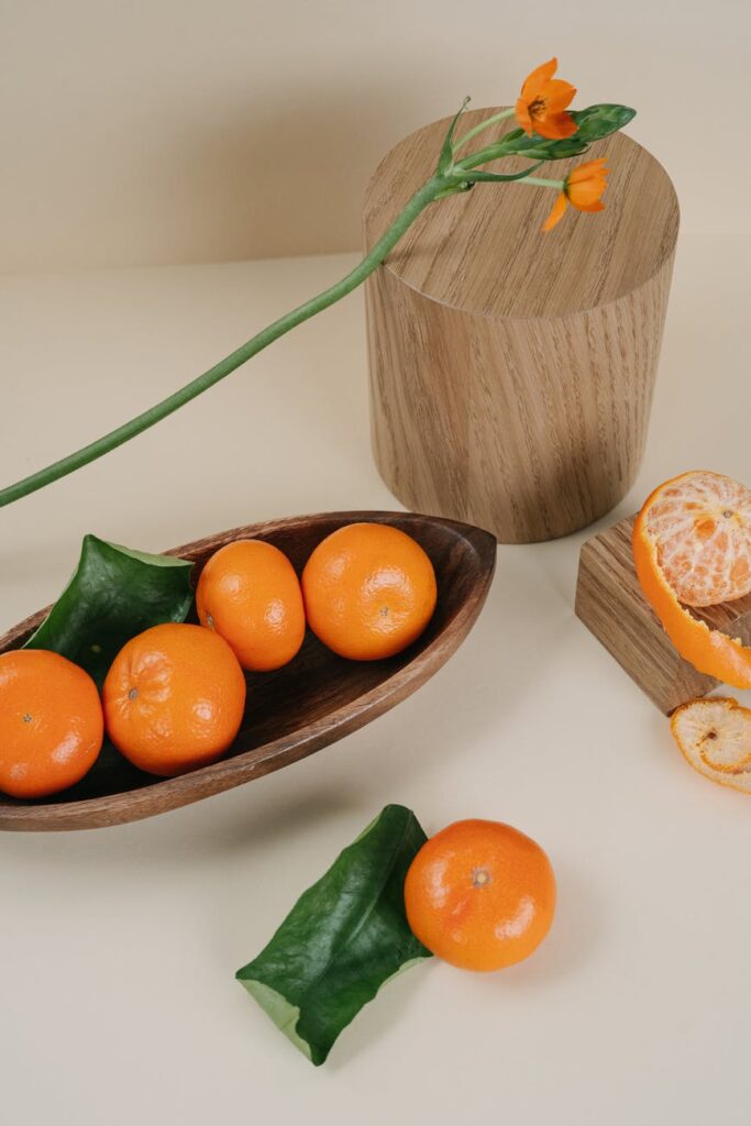 tangerines on a wooden tray
