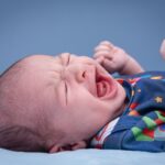 Why does my child throw up when crying?